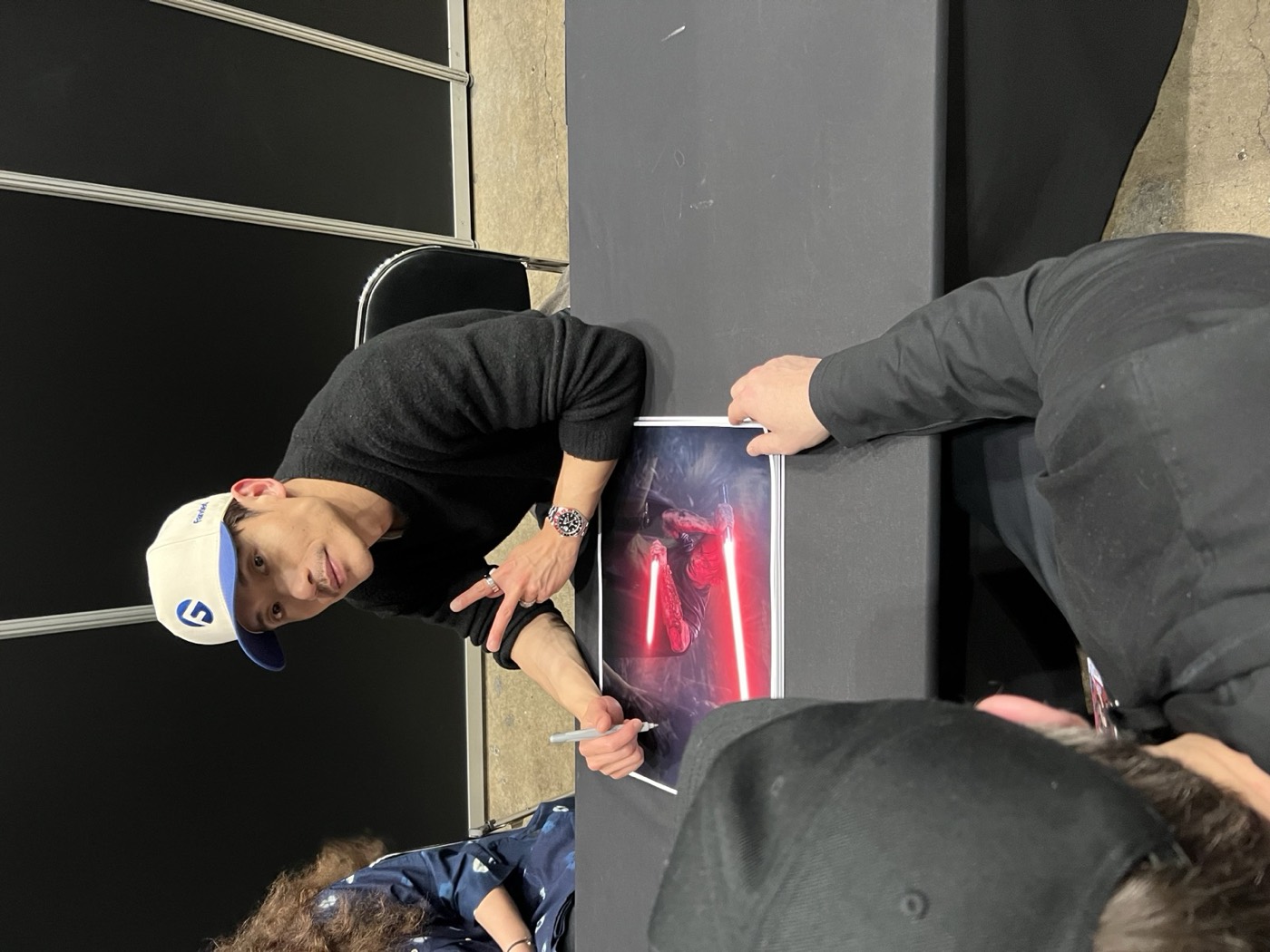 Manny Jacinto signing for a club member